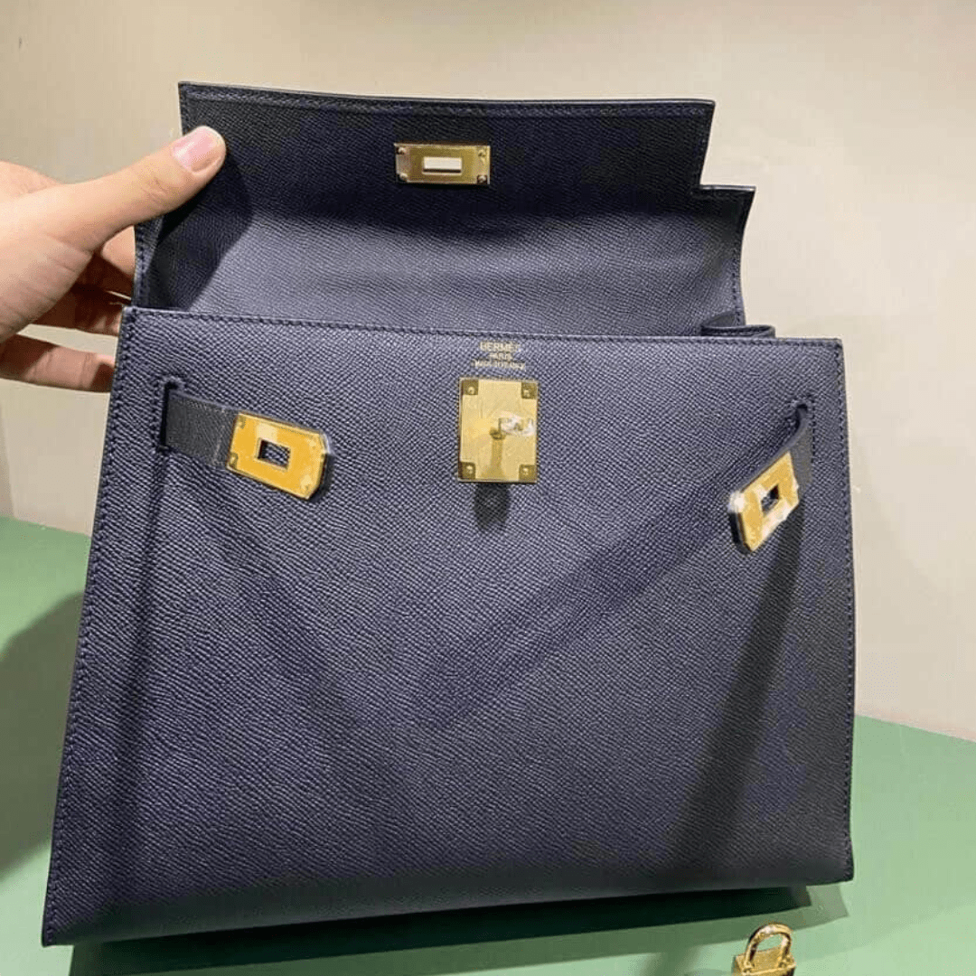Hermès Kelly 25 Tasche mit goldener Hardware in Schwarz